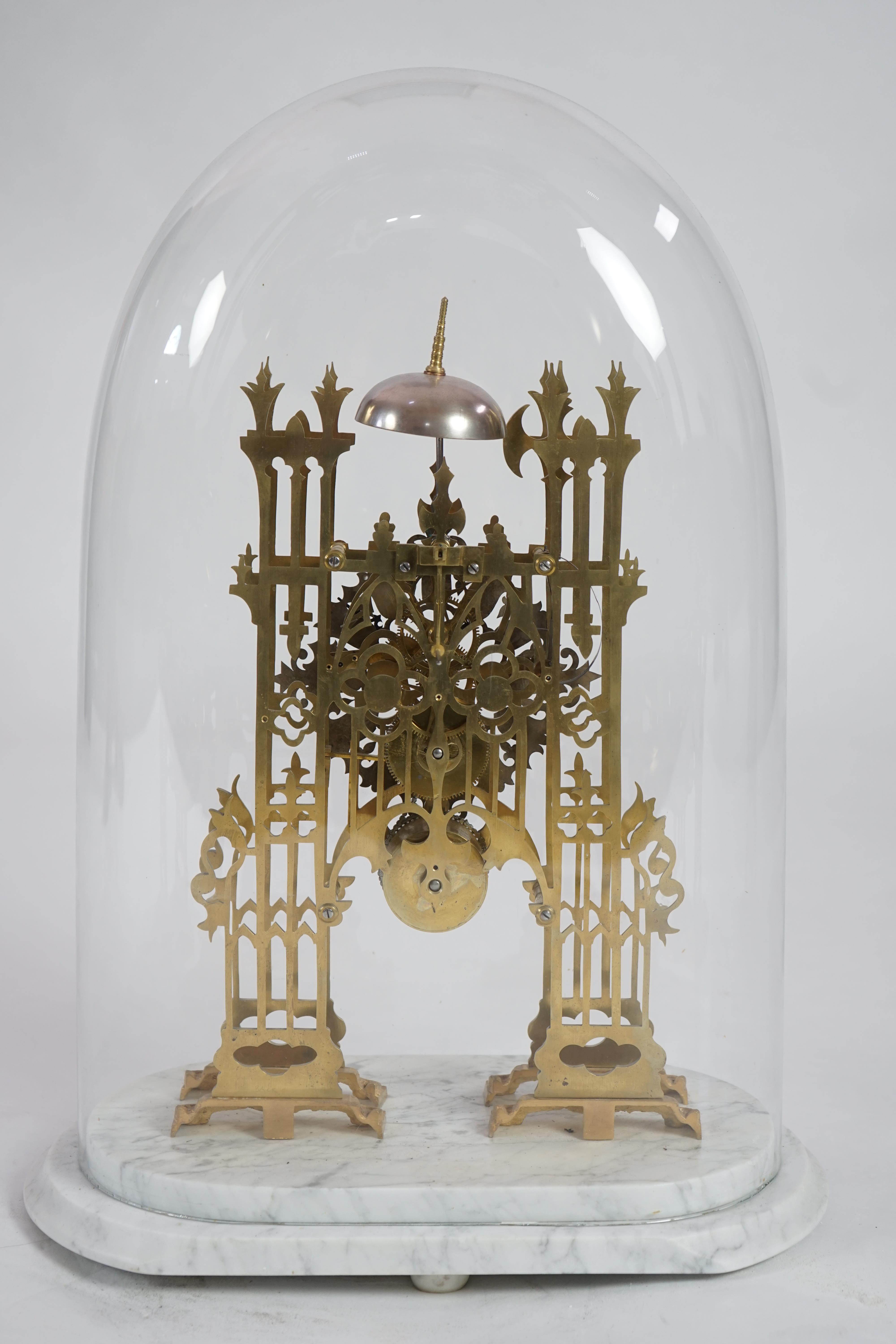 A Victorian brass cathedral front skeleton clock